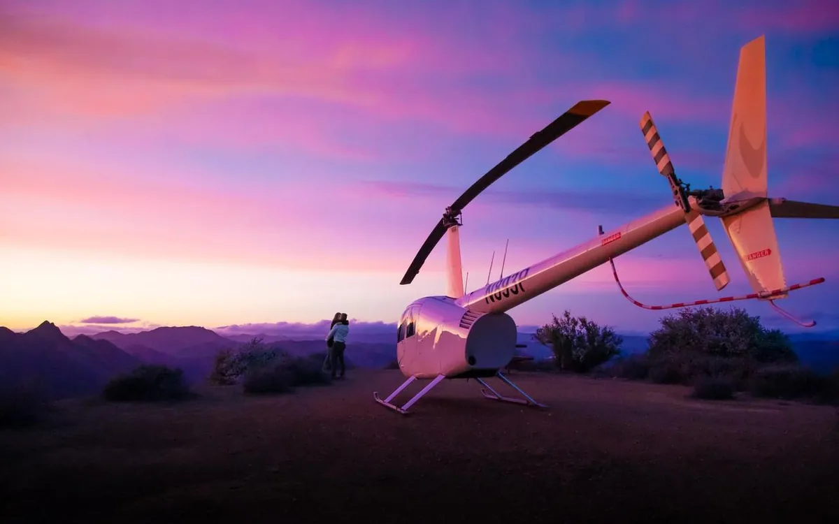 A helicopter on a mountaintop landing site above Malibu